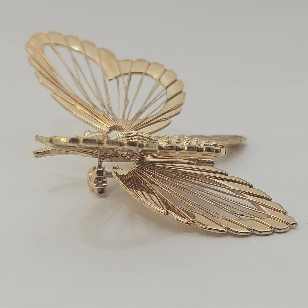 Vintage Monet gold tone butterfly brooch signed